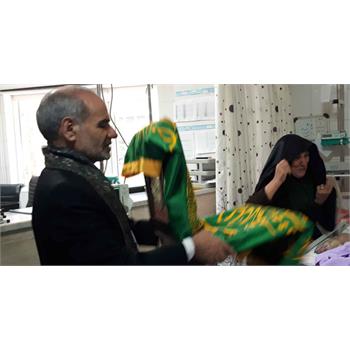 پرچم حرم رضوی بیمارستان شهید چمران کنگاور را متبرک کرد